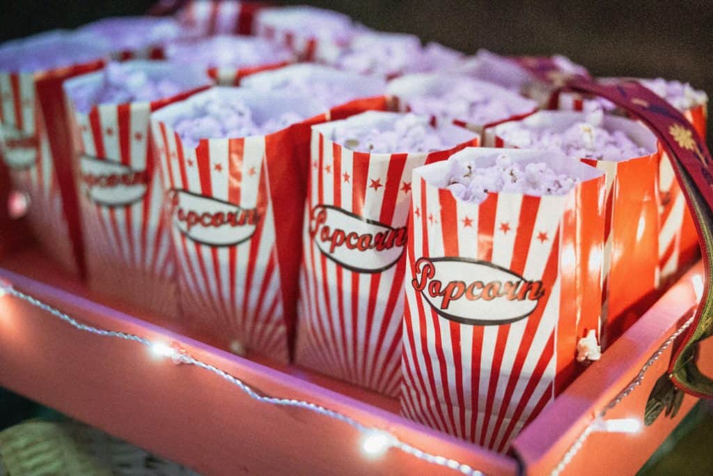 multiple small red bags of popcorn for movie night with family