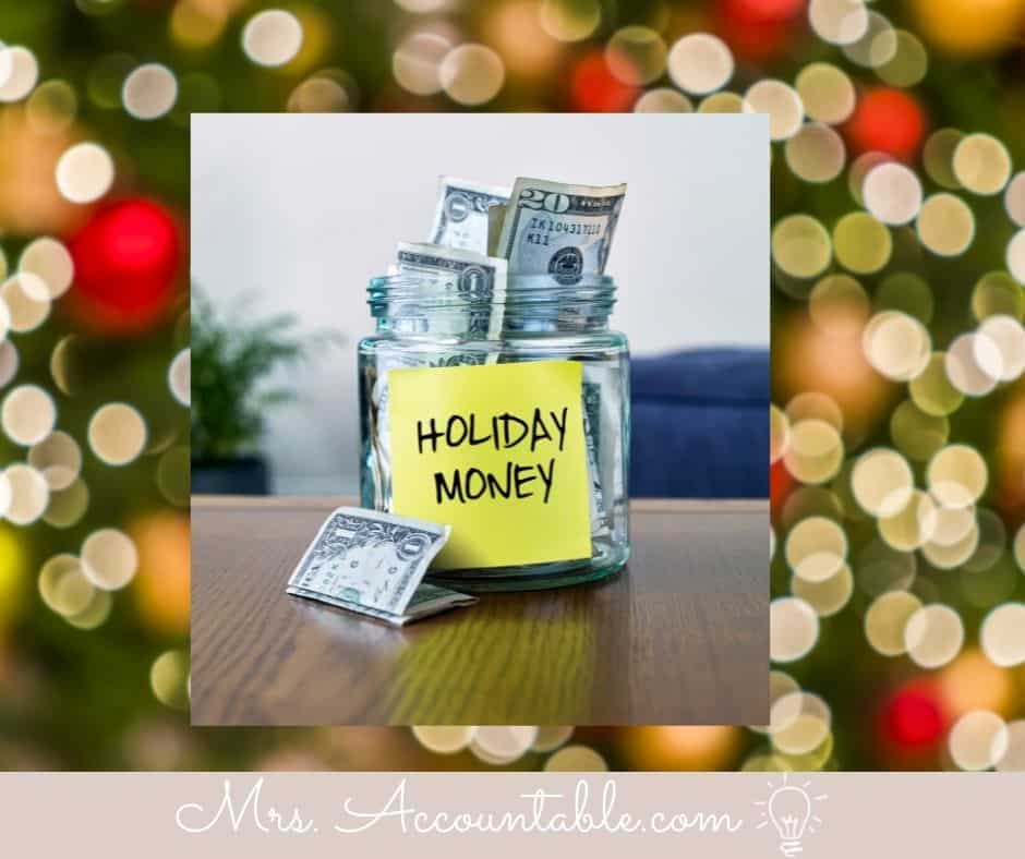 A JAR OF MONEY WITH A STICKY NOTE SAYING HOLIDAY MONEY